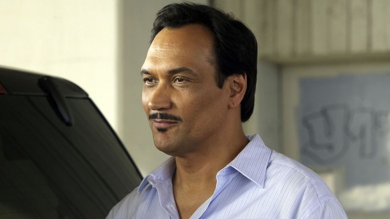 Jimmy Smitts as Miguel Prado, smiling next to a car in Dexter.