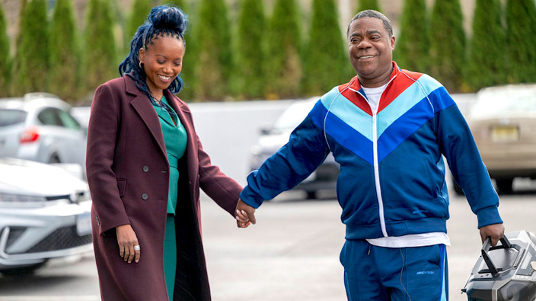 Monica e Reggie em A Queda e Ascensão de Reggie Dinkins