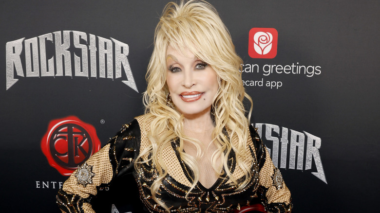 Dolly Parton smiles at an event