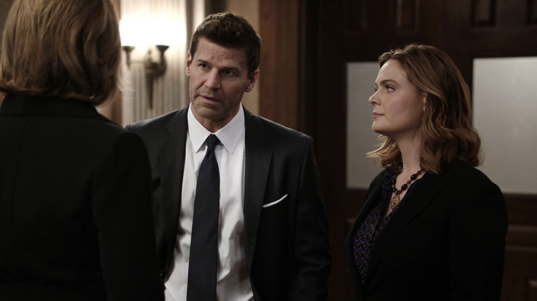 Seeley Booth and Temperance Brennan stand together in an office on Bones (2005-2017)