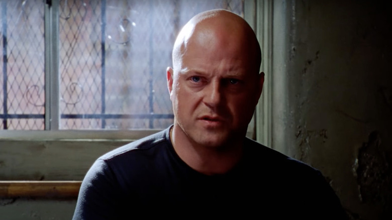 Mackey sitting in a dark room on "The Shield"