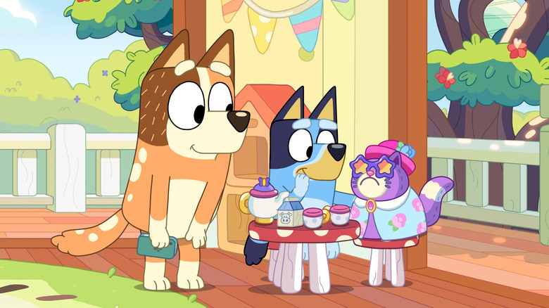 Bluey having a tea party with a cat on Bluey