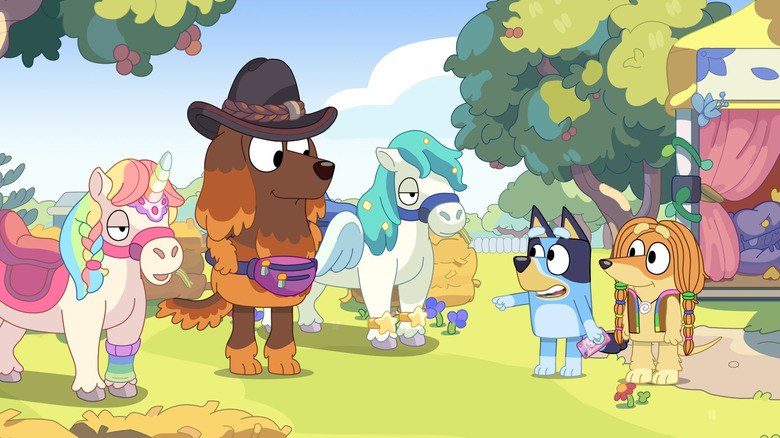 Bluey and Indy looking at ponies on Bluey