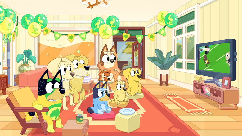 The Heeler family and friends watching a rugby match on Bluey