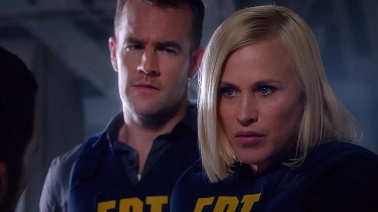 Avery Ryan and Elijah Mundo speaking to someone in "CSI: Cyber"