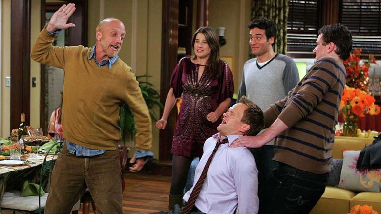 Mickey prepares to slap Barney in How I Met Your Mother Season 5