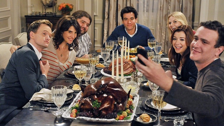 Ted and friends gather around the table in How I Met Your Mother Season 6