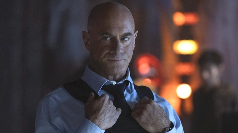 Elliot Stabler (Christopher Meloni) puts his hands on his bulletproof vest in Law & Order: Organized Crime