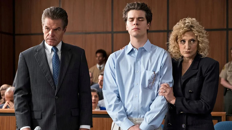 Leslie Abramson (Edie Falco) holds Erik Menendez (Gus Halper) in a courtroom next to Barry Levin (Harry Hamlin) in Law & Order True Crime