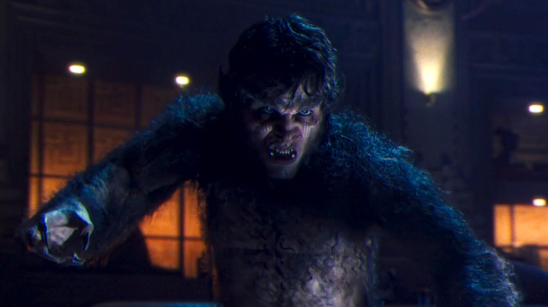 Gael García Bernal as Werewolf by Night, with fur all over his body, pointy teeth, and claws.