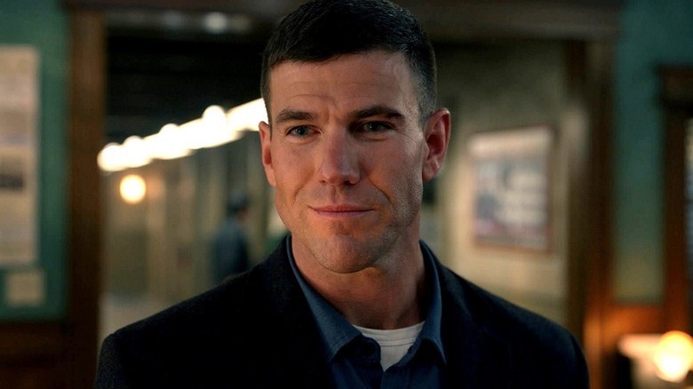 Leroy Jethro Gibbs (Austin Stowell) smiles in an office in NCIS: Origins