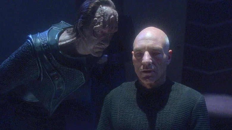 Gul Madred (David Warner) leans menacingly over Jean-Luc Picard (Patrick Stewart) in Star Trek: The Next Generation