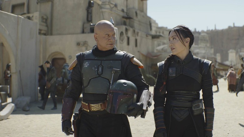 Boba Fett and Fennec Shand walk the streets of Mos Espa in The Book of Boba Fett