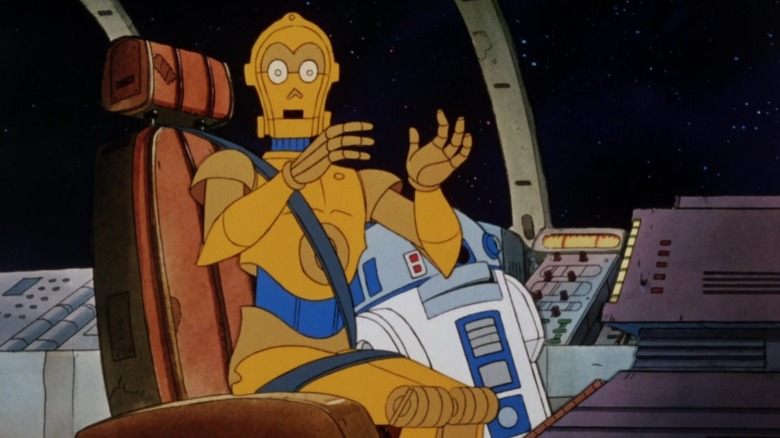 Artoo and Threepio sitting next to each other in on Droids