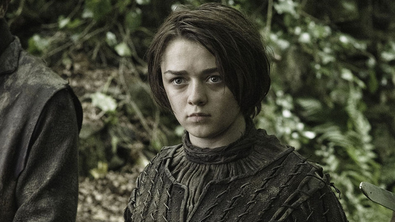 Maisie Williams as Arya Stark in the woods in Game of Thrones