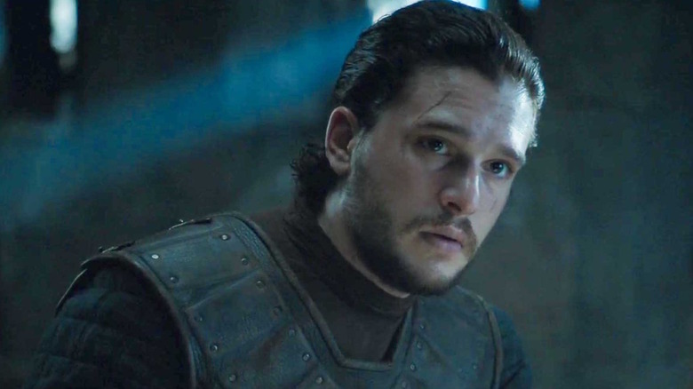 Kit Harington as Jon Snow with his hair tied back in Game of Thrones