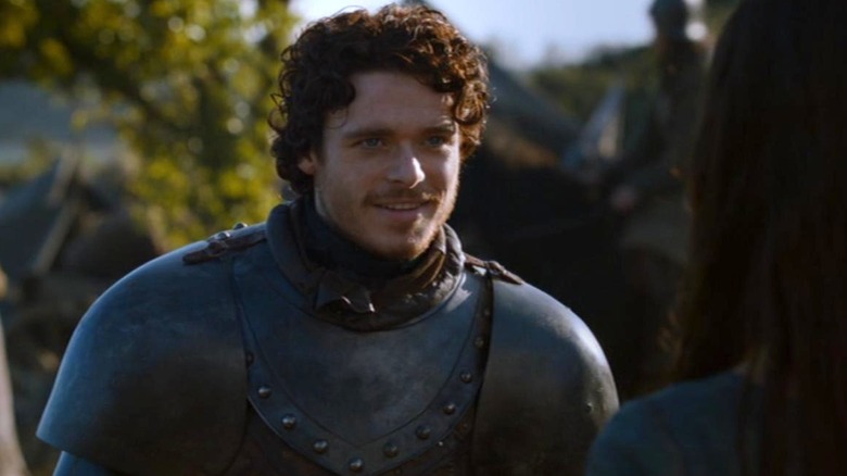 Richard Madden as Robb Stark smiling at Oona Chaplin as Talisa in Game of Thrones