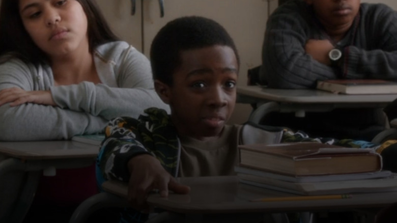 A boy (Caleb McLaughlin) asks a cop a question in Law & Order: Special Victims Unit