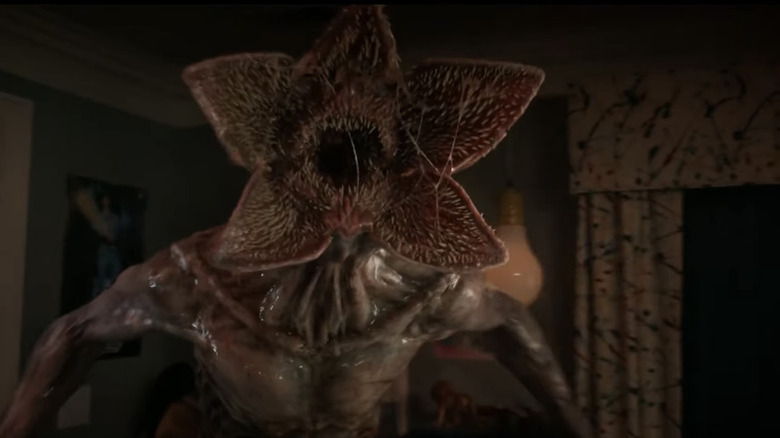 The Demogorgon roars in a kitchen in Stranger Things