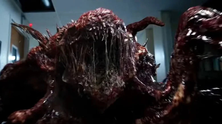 The meat monster roars in a hallway in Stranger Things