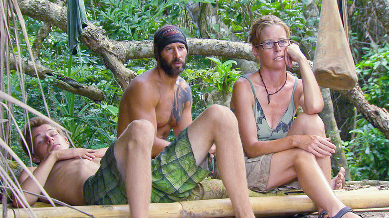 Spencer, Tony, and Kass sitting at camp and looking confused on Survivor