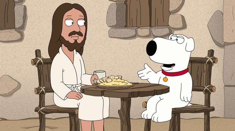 Jesus and Brian Griffin sitting at a table together in Family Guy's Season 22 episode "Faith No More."