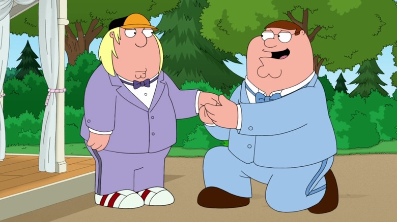 Peter holding Chris' hand and bending down on one knee in Family Guy's Season 12 episode "Fresh Heir"