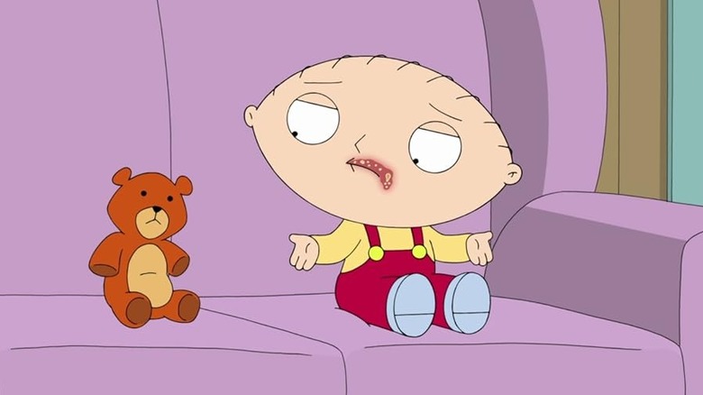 Stewie on the couch with his stuffed bear with a cold sore on his upper lip in Family Guy's Season 12 episode "Herpe, the Love Score"