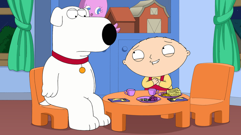 Brian and Stewie sitting a table in Stewie's room in Family Guy's Season 13 episode "Stewie Is Enceinte"