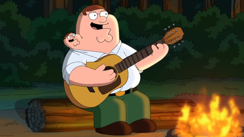 Peter and his vestigial twin, Chip, playing guitar by a campfire in Family Guy's Season 12 episode "Vestigial Peter"