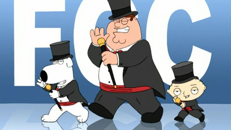 Brian, Peter, and Stewie Griffin performing a musical number in front of a sign that reads "FCC" on Family Guy S4E14