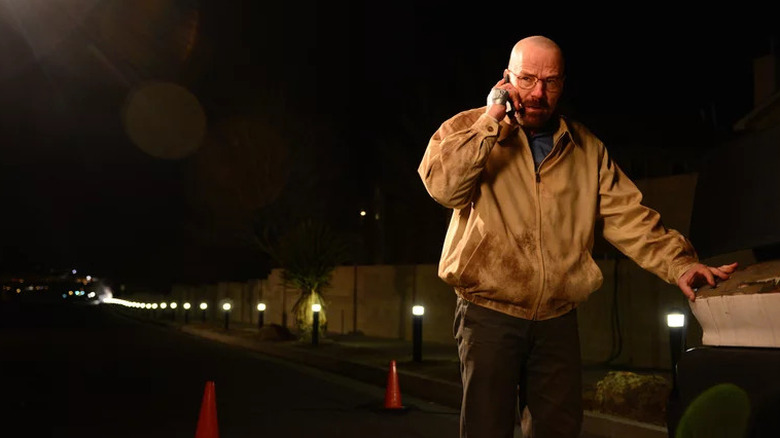 Bryan Cranston as Walter White outside at night talking on phone in Breaking Bad