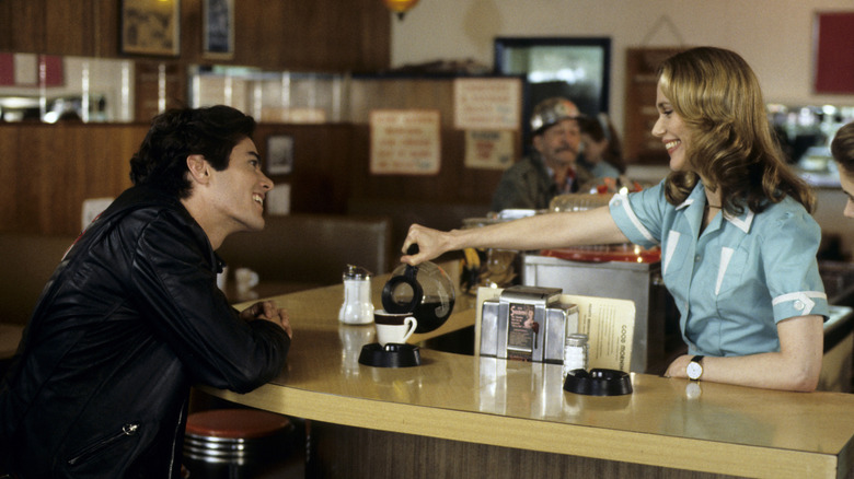 Bobby (Dana Ashbrook) and Norma (Peggy Lipton) smiling and laughing at the Double R Diner in Twin Peaks