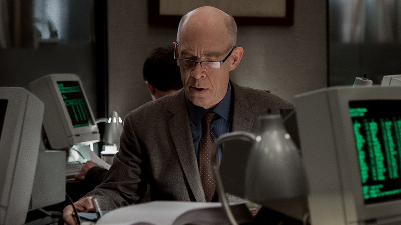 Howard Silk works at a computer in Counterpart