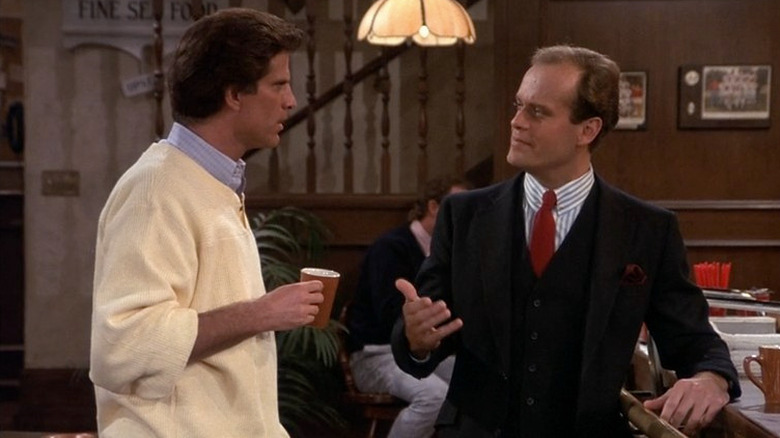Ted Danson and Kelsey Grammer as Sam Malone and Dr. Frasier Crane talking on Cheers