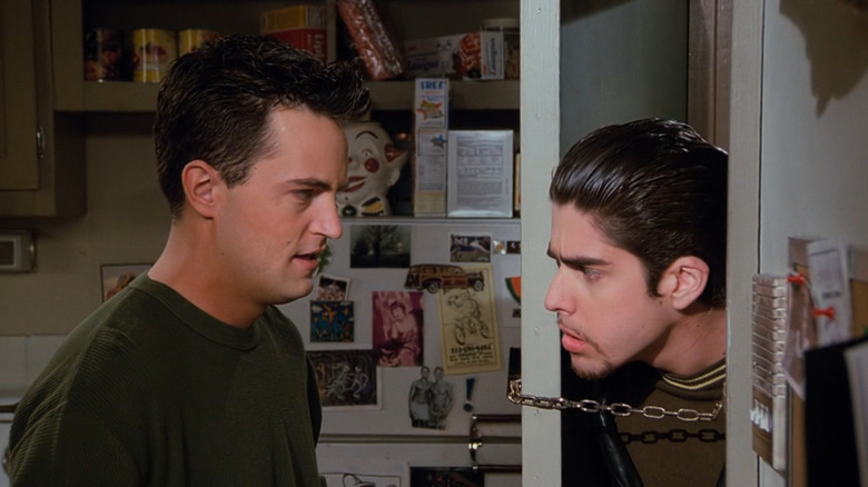 Eddie stands on other side of door from Chandler