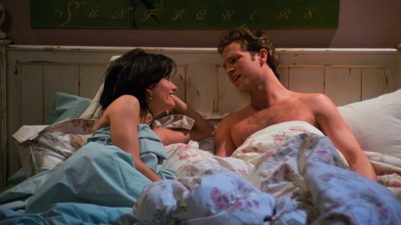 Ethan and Monica lay in bed together