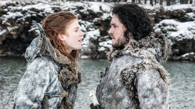 Rose Leslie as Ygritte facing Kit Harington as Jon Snow near a river in Game of Thrones