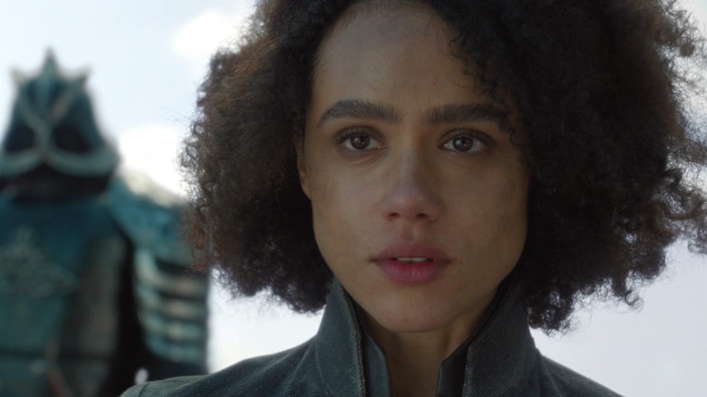Missandei staring out ahead with misty eyes while Gregor stands behind her on Game of Thrones S8E4