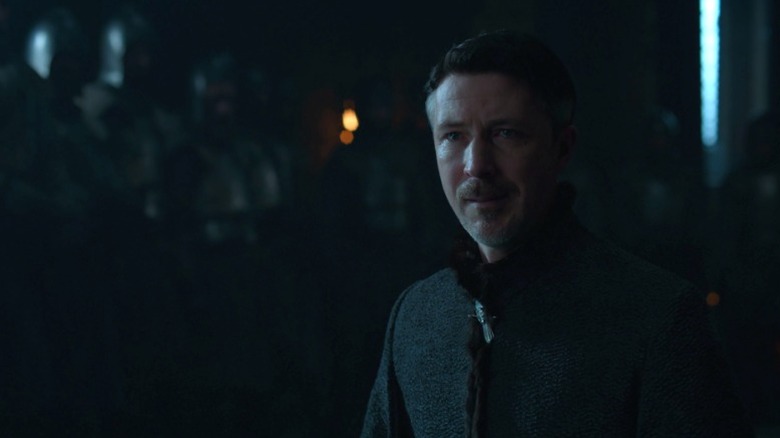 Petyr kneeling with tears in his eyes on Game of Thrones S7E7
