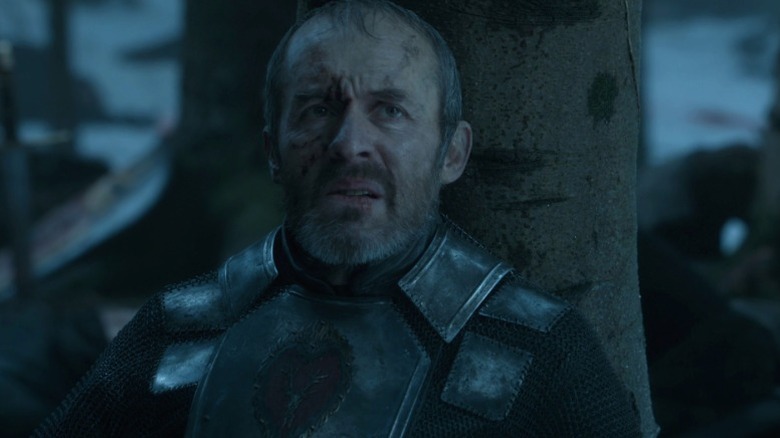 Stannis resting against a tree and looking up on Game of Thrones S5E10