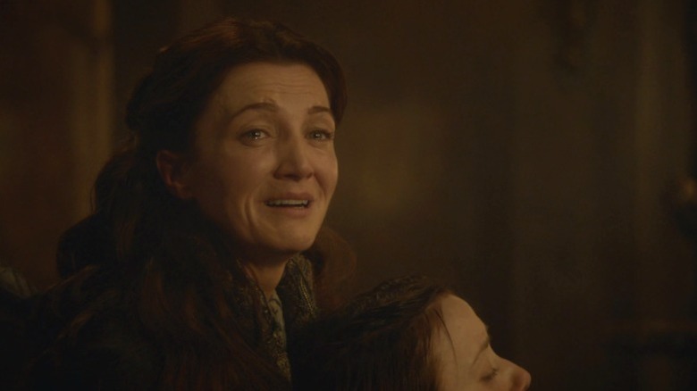 Catelyn crying while holding Joyeuse hostage on Game of Thrones S3E9