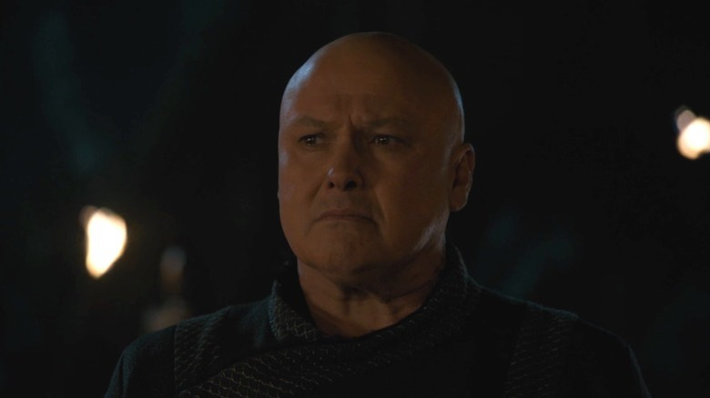 Varys standing on the shore and furrowing his brow on Game of Thrones S8E5