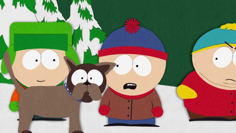 Sparky and the "South Park" gang stand at a bus stop in "South Park" (1997)