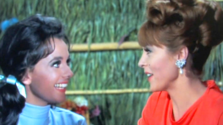 Mary Ann and Ginger talking in hut