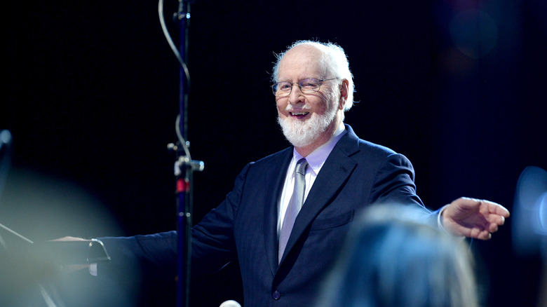 John Williams conducting an orchestra