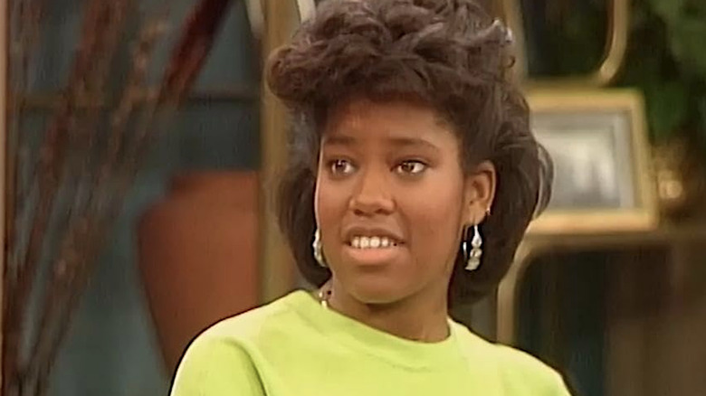 Brenda Jenkins in a green shirt and silver earrings in 227
