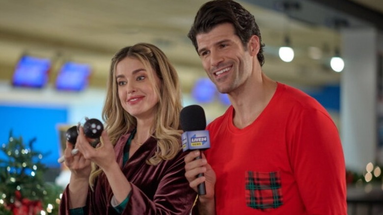Audrey Bell and Jason Miller standing next to each other during a holiday news segment
