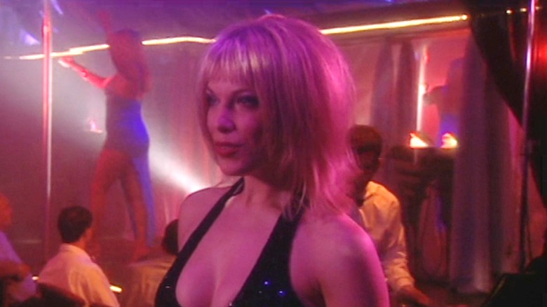 Hannah Waddingham as Jenny Turbot standing in a strip club on Coupling