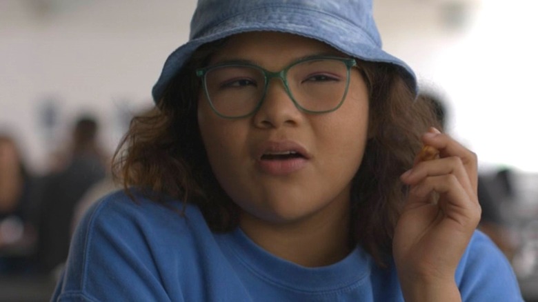 Shanti in "American Horror Stories" holding up her hand while talking